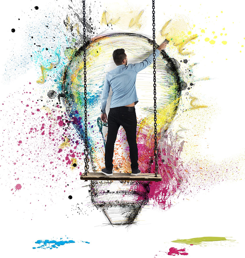 Graphic designer painting lightbulb